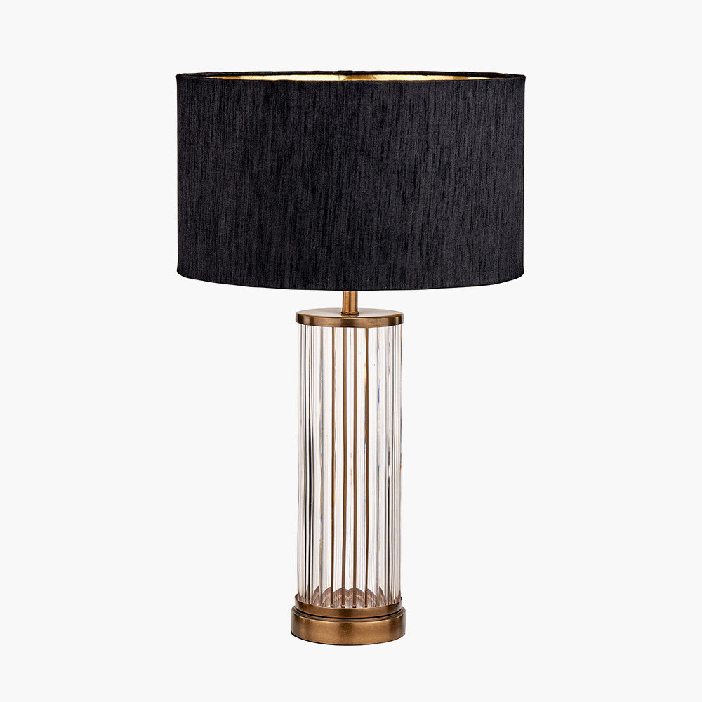 Ciara Clear Glass and Antique Brass Metal Table Lamp Base with Stellan 35cm Black Slubbed Silk Mix Gold Lined Cylinder Lampshade