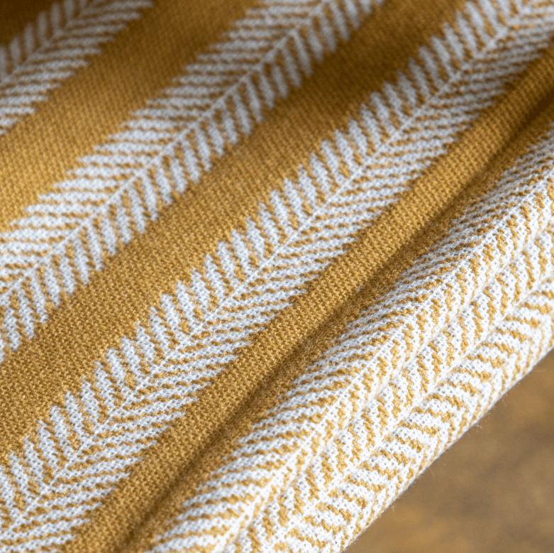 Devoran Knitted Tassel Throw Ochre.