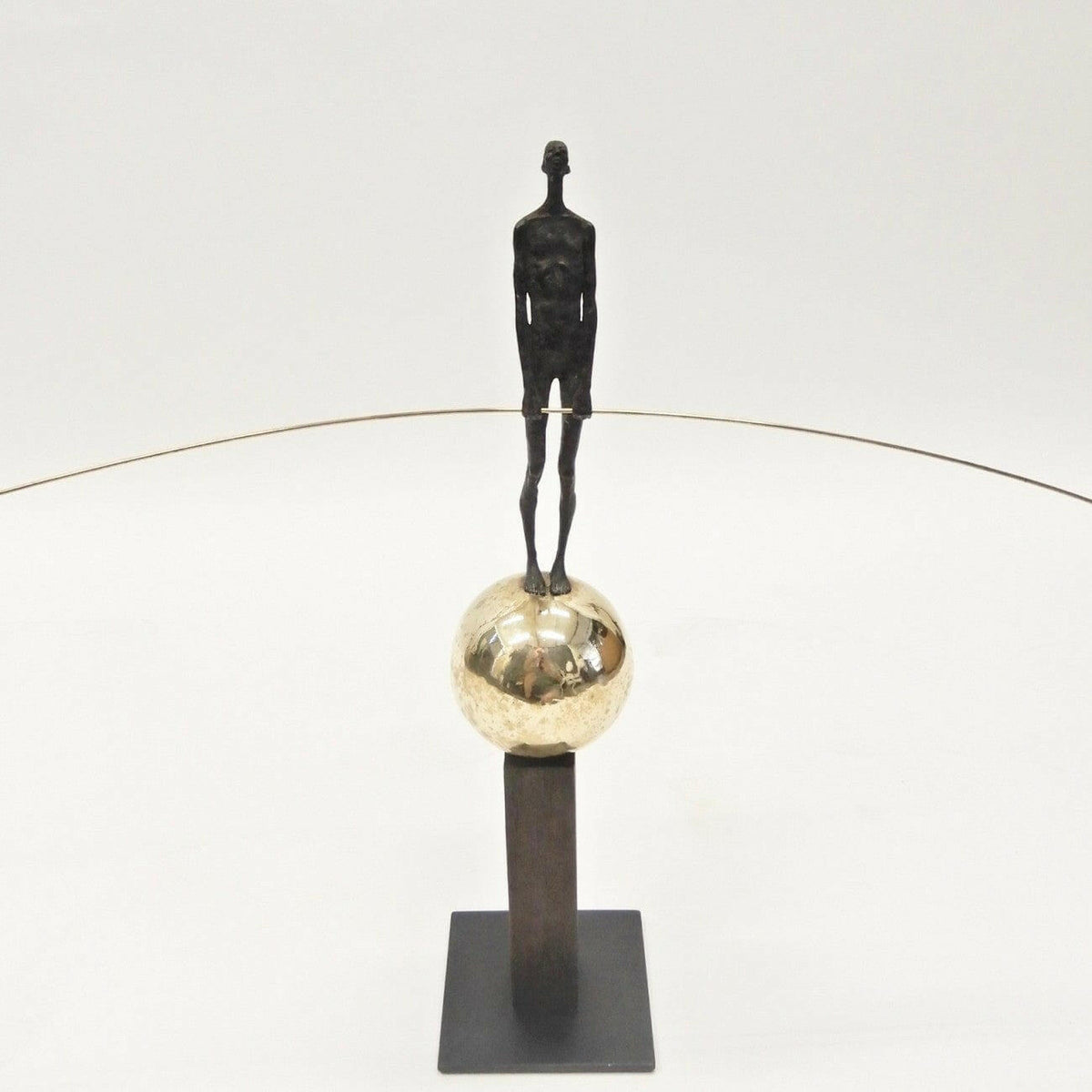 Bronze Figure On Sphere With Stick.