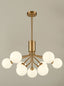 Franklite Lighting Cosmic 9 light pendant in antique gold with matt opal glass House of Isabella UK