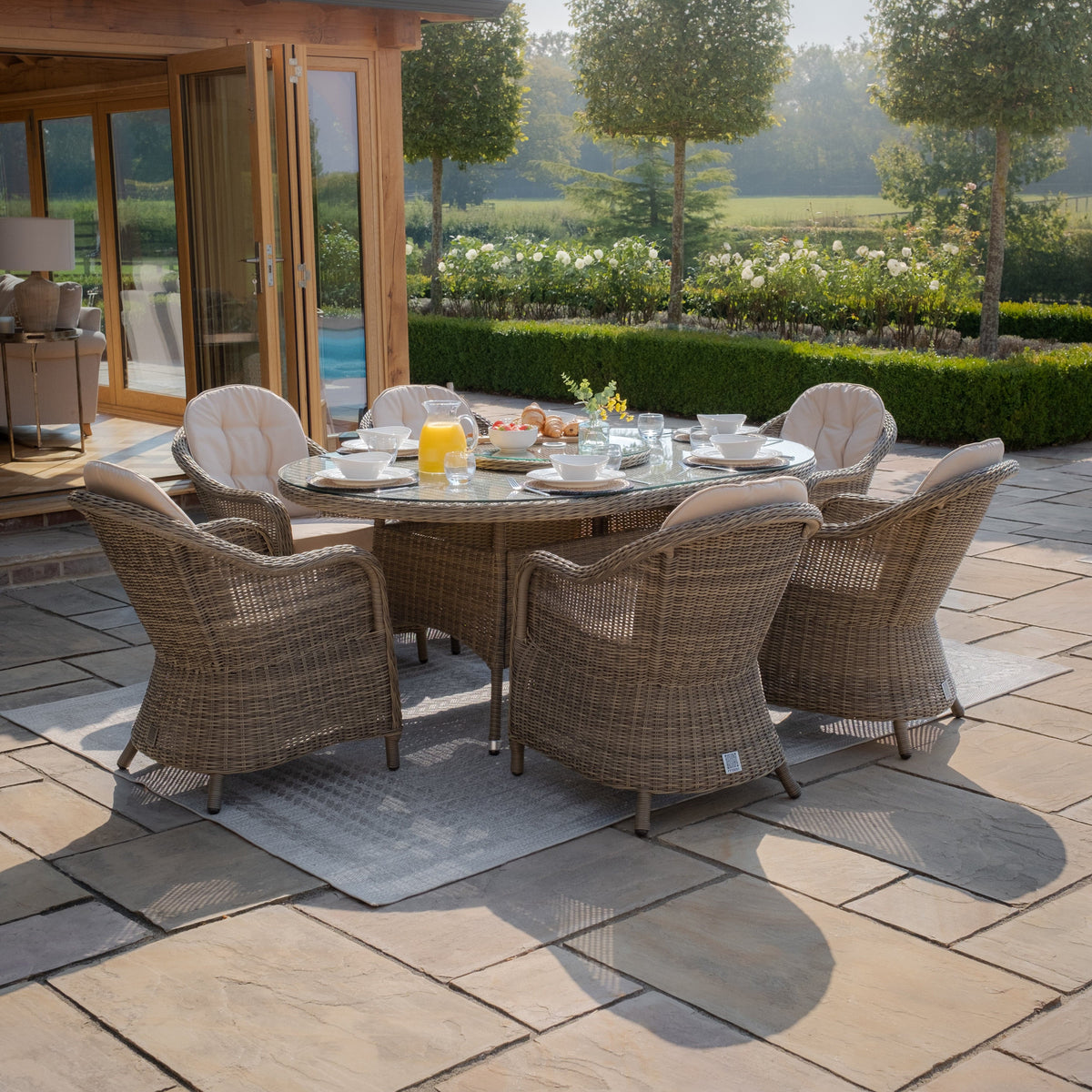 Maze Outdoors Winchester 6 Seat Oval Dining Set with Heritage Chairs & Woven Lazy Susan House of Isabella UK