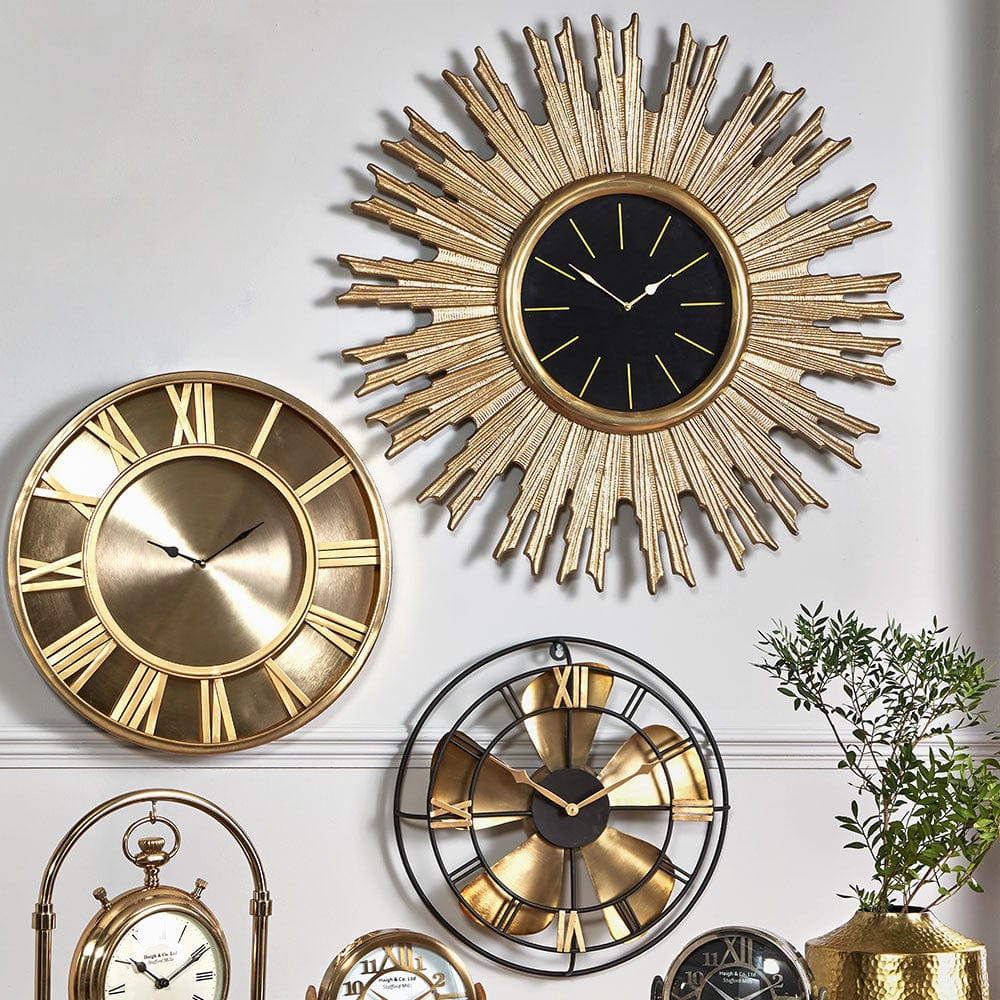 Gold Metal and Black Face Starburst Wall Clock.