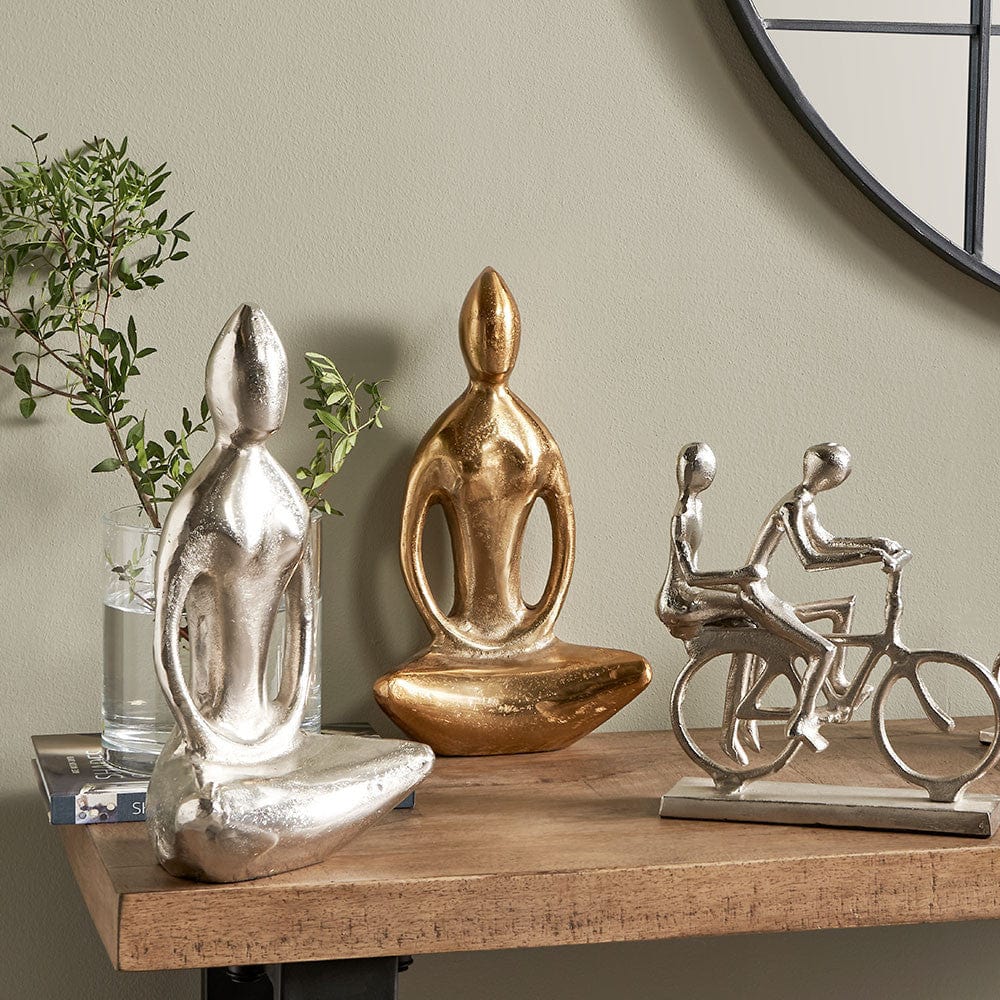 Shiny Nickel Sitting Statue.