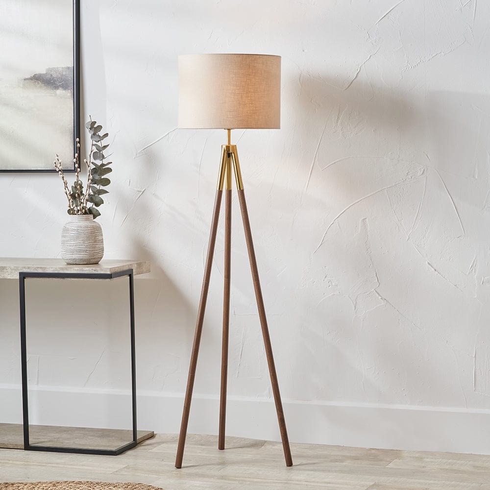 Vali Gold Metal and Brown Wood Grain Tripod Floor Lamp.